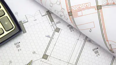 Multiple building plans on paper